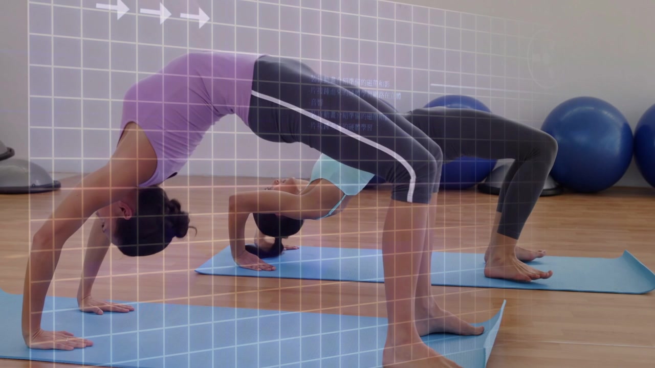 Two women following cue pressing into bridge rising to backbend for fitness on mats grid overlaying