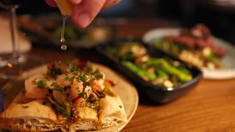 shrimp on bread with lemon juice