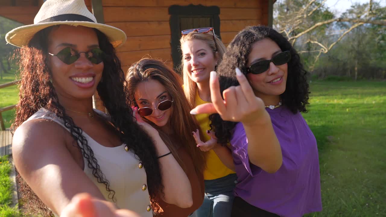 A group of fashionable women posing outdoors