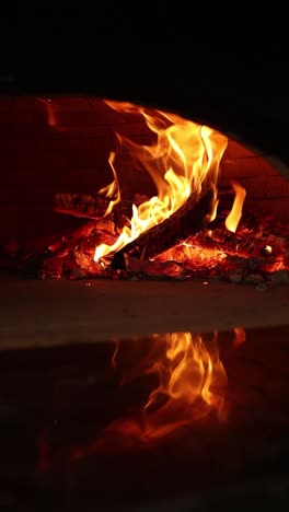 wood-fired oven with flames