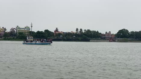 Kolkata,-India-:-Shot-of-a-ferry-boat-moving-over-river-Ganga-on-a-cloudy-day