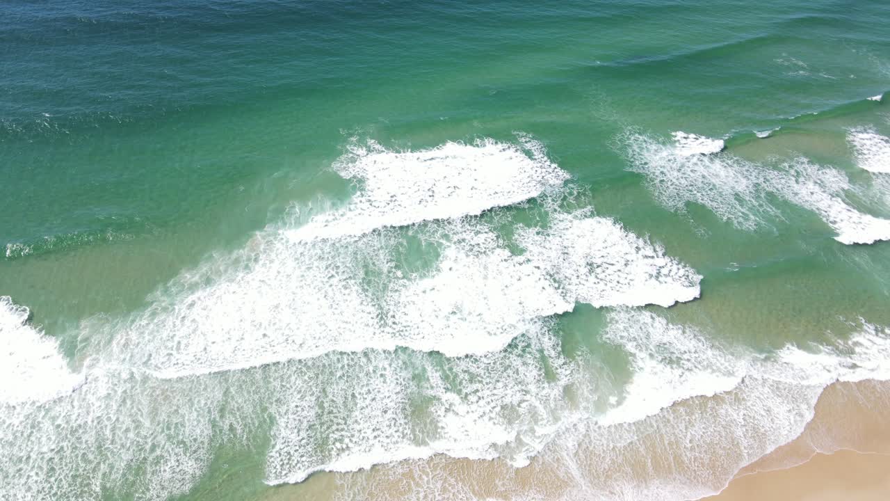 Aerial drone rotating above pristine beach and lush landscape in Noosa National Park, QLD