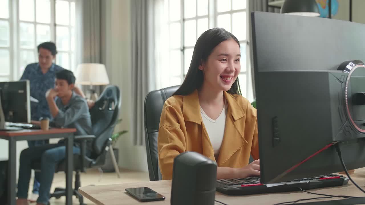 Asian Female Works Her Personal Computer In Office