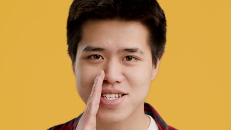 man whispering a secret
