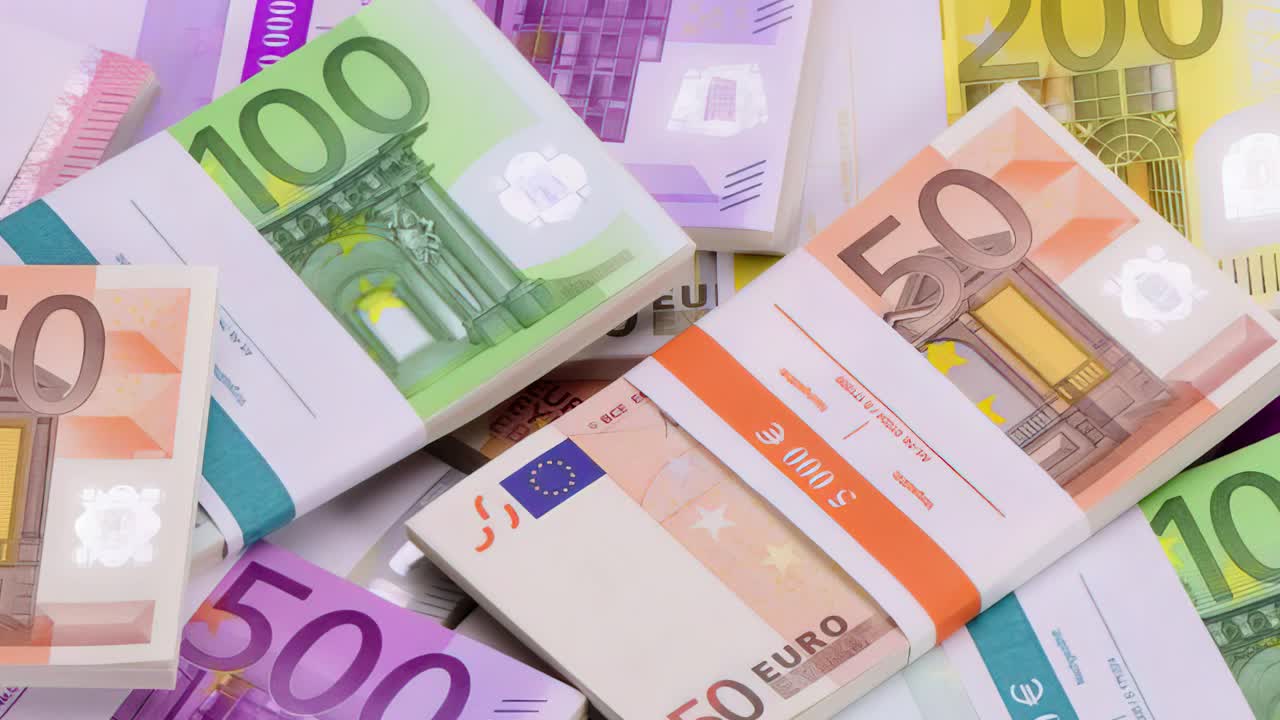 A close-up of counting euro banknotes. Cash money in the background.