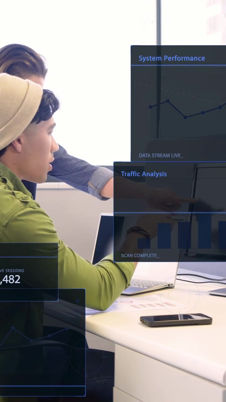 Vertikal video: Kamera panorerer, kvinde i gul sweater skriver diagrammer, studerer HUD-data til analyse.