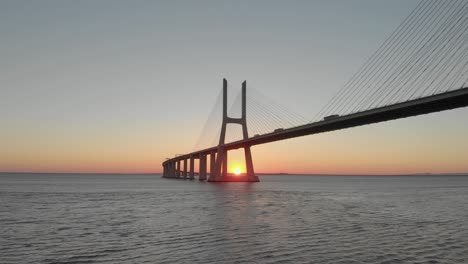 evocative setting golden sun over tago river behind vasco da gama bridge