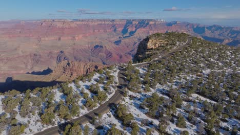 aerial of a vehicle driving at the scenic viewpoints in grand canyon national park in arizona, united states