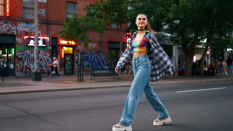 a woman walks confidently across a city street in a stylish outfit