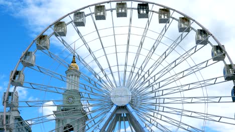 close-up big white ferris wheel rotates in kiev city, ukraine,