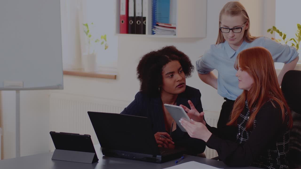 Businesswoman explaining strategy to colleagues