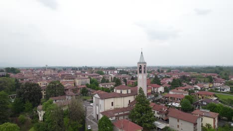 establisher aerial of capriate san gervasio town with view of church tower