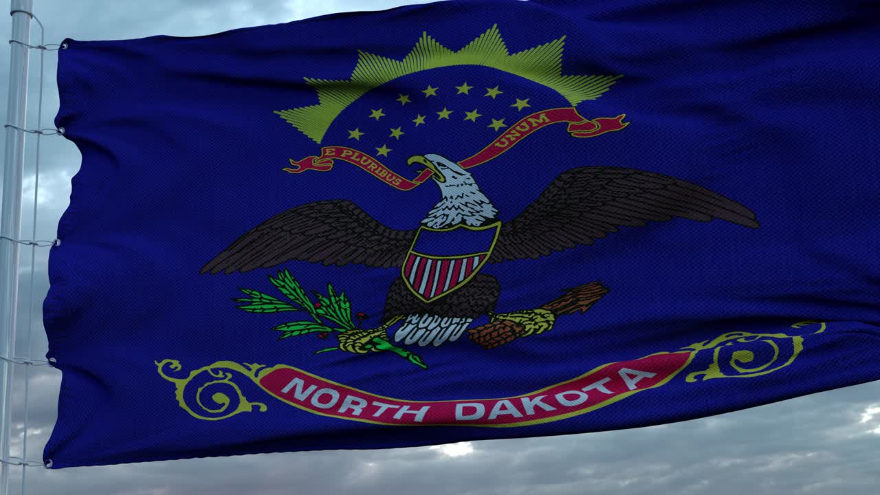 Flag of North Dakota waving in the wind against deep beautiful clouds sky