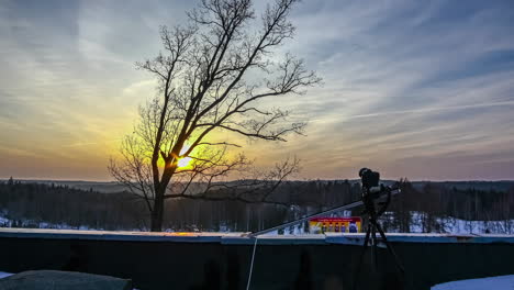 Setting-up-a-time-lapse-using-a-slider-over-a-ski-resort-at-sunset---time-lapse-of-a-time-lapse