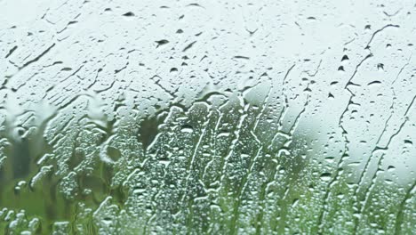 raindrops on window with blurred background