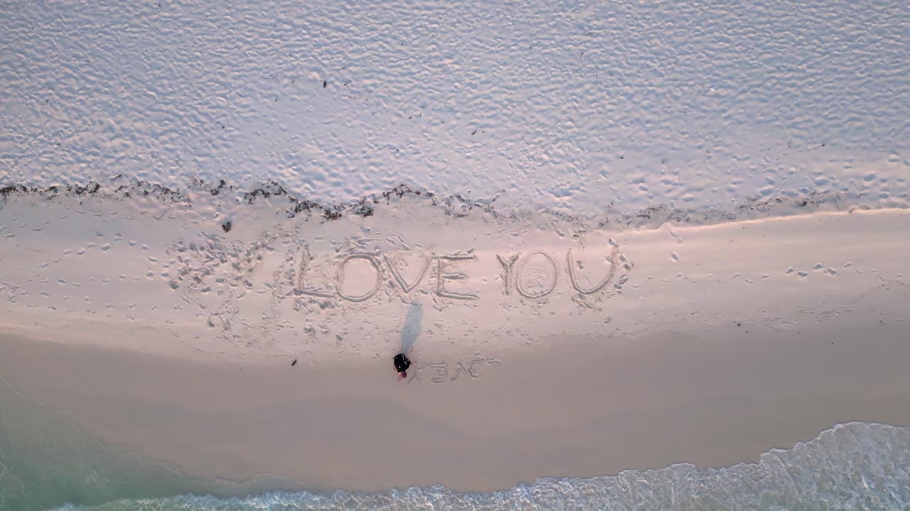 write letters I Love you Turquoise water gently washing white sand beach with palm trees of Koh Rong island. Best aerial view flight speed ramp hyper motion time lapse