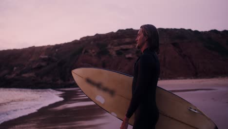 surfer at sunset beach