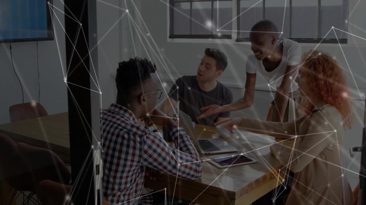 Leaning initiating network graphics on screens as coworkers sharing documents for business meeting