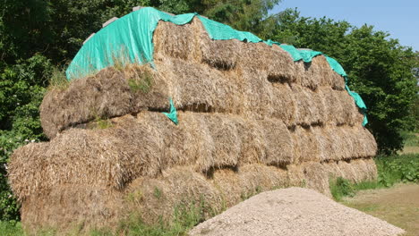 Close-up-of-a-haystack-covered-with-a-tarpaulin