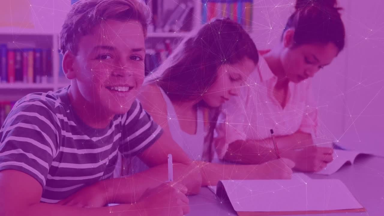 Animation of network of connections moving over smiling schoolboy writing in classroom