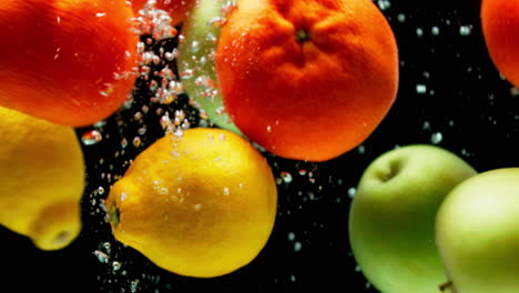 fruits splashing in water