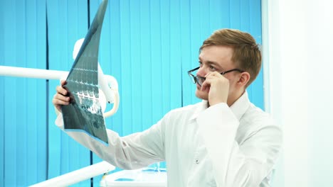 dentist reviewing x-ray image