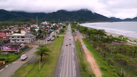 aerial view of highway passing beside beach