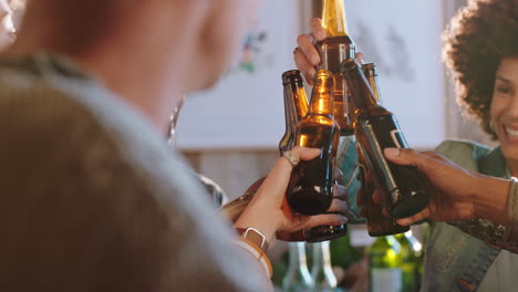 happy group of friends making toast having fun drinking socializing hanging out chatting sharing conversation enjoying reunion gathering at sunset