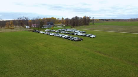 arieal of cars in field at event