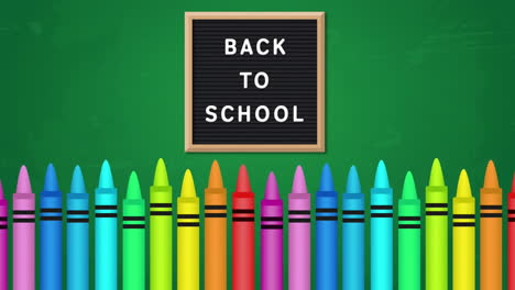 animation of back to school text on chalkboard over colored crayons against green background