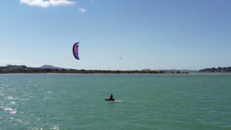 perfect wind conditions for kiteboarders while surfing really fast, aerial shot