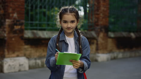 girl writing in park