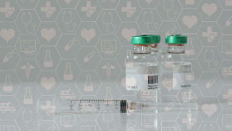 animation of medical icons over vials