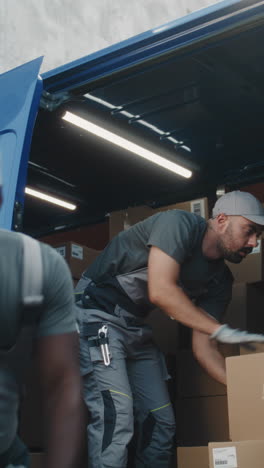 delivery workers loading packages into a truck