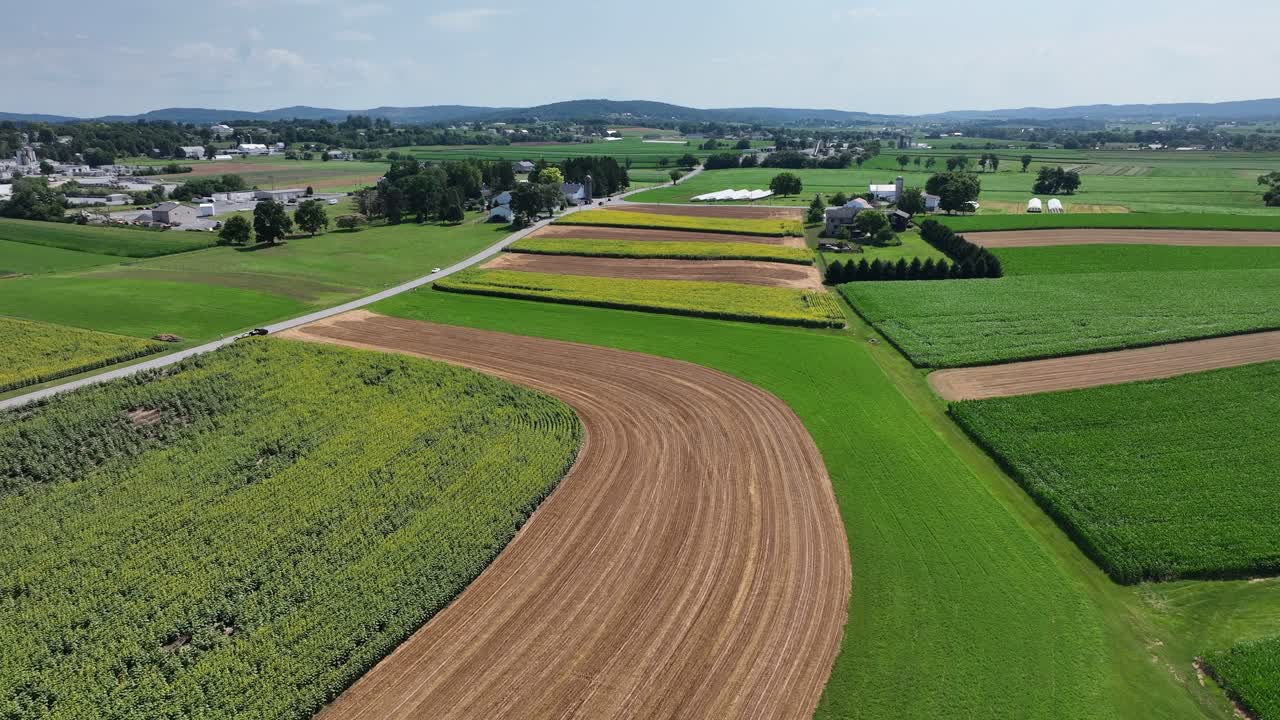 An aerial view of the lush green farmland of southern Lancaster County, Pennsylvania during the summer