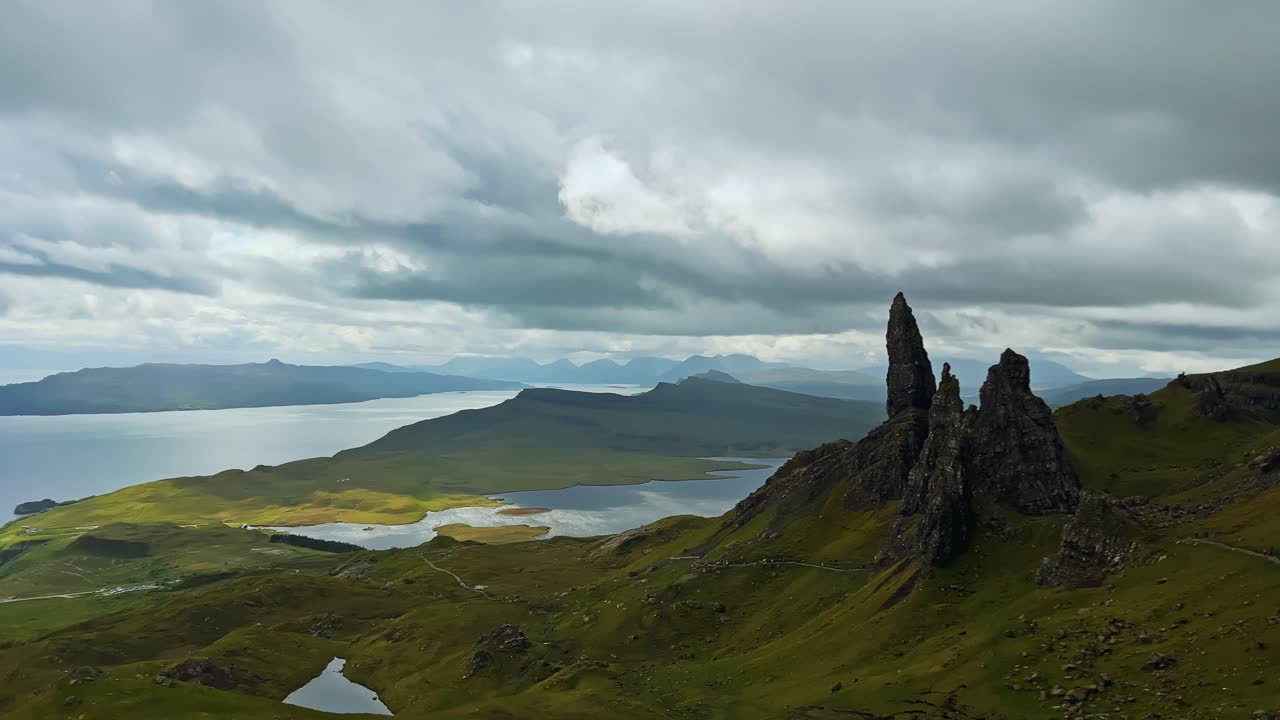 The Old Man of Storr Rock Formation On The Mountain On Trotternish Peninsula Of Isle of Skye in Scotland. - wide pan shot