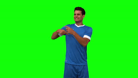 Football-player-calling-doctors-on-green-screen