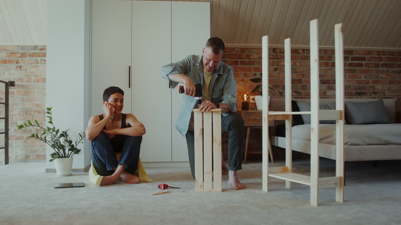 Couple Assembling a Wooden Shelf