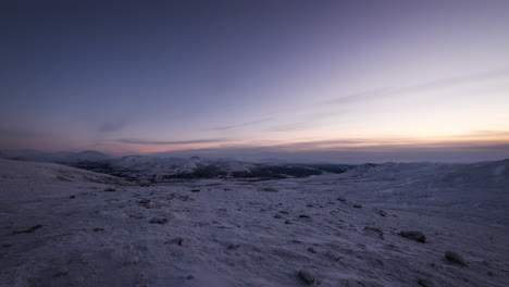 beautiful sunrise over snowy landscape in dovrefjell mountain range in norway at winter