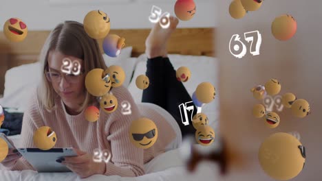 animation of social media icons and numbers falling over woman using smartphone