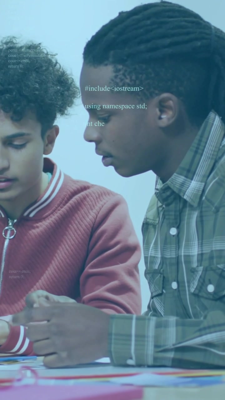 Vertical video: Two peers leaning, using device, causing code overlay highlighting education cards