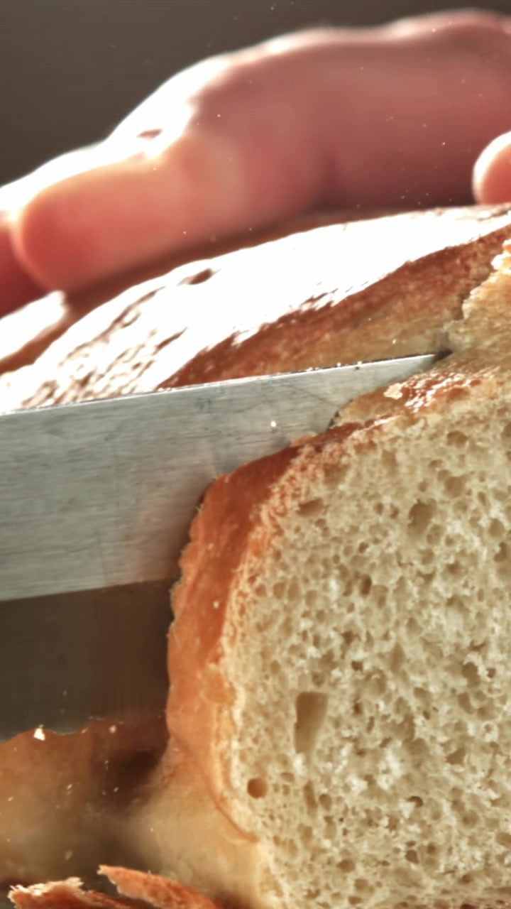 Slow Motion Slicing of a Freshly Baked Baguette