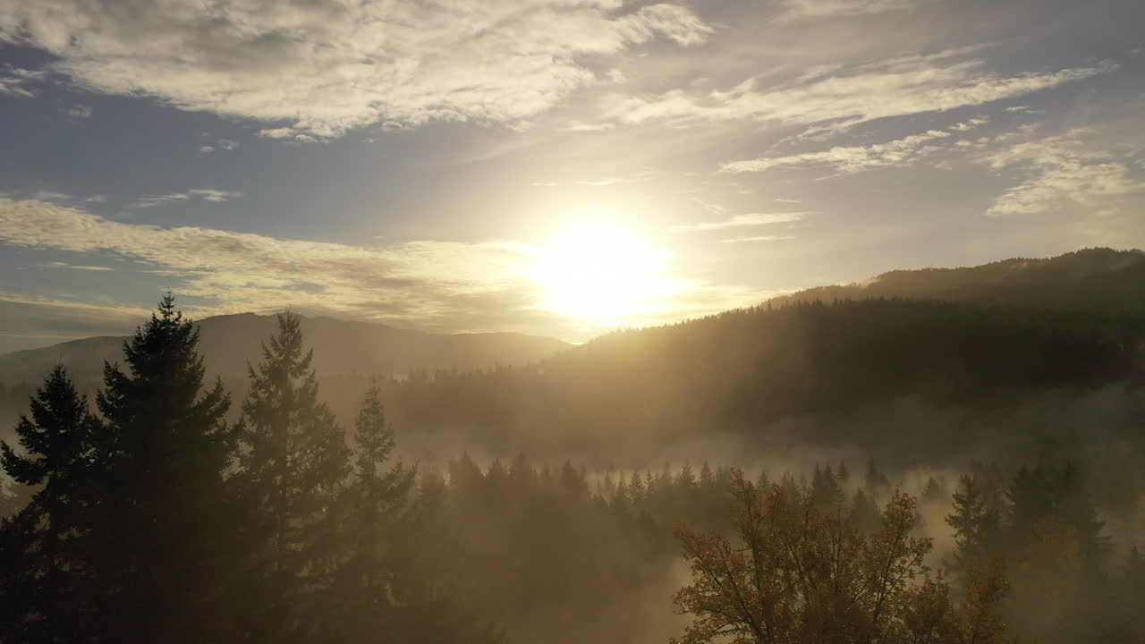 Glorious Aerial Morning Sunrise over the foggy mountain range