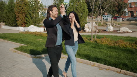 couple walking and enjoying a sunny day in the city