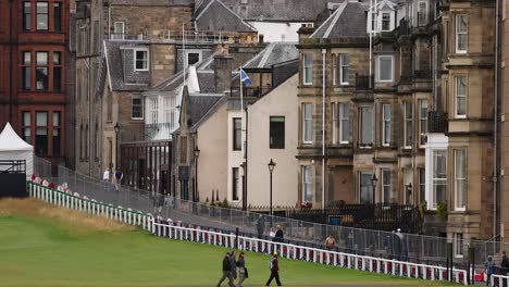 people walking along a street in st andrews