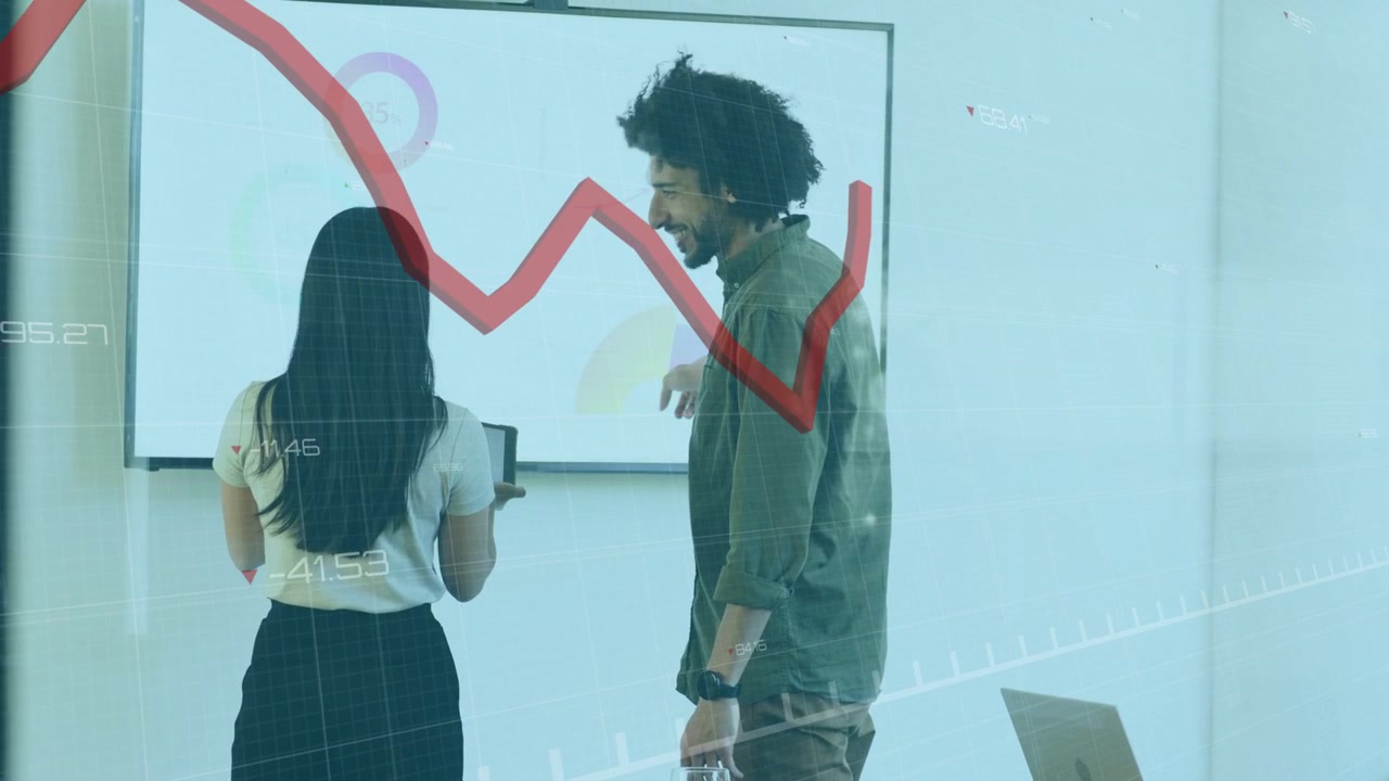 Woman tapping tablet and man pointing at display, animating red trend line for business analysis