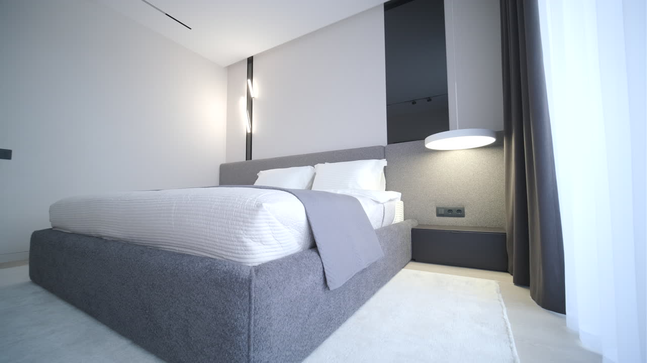 Interno camera da letto moderno e minimalista con letto grigio e biancheria da letto bianca.