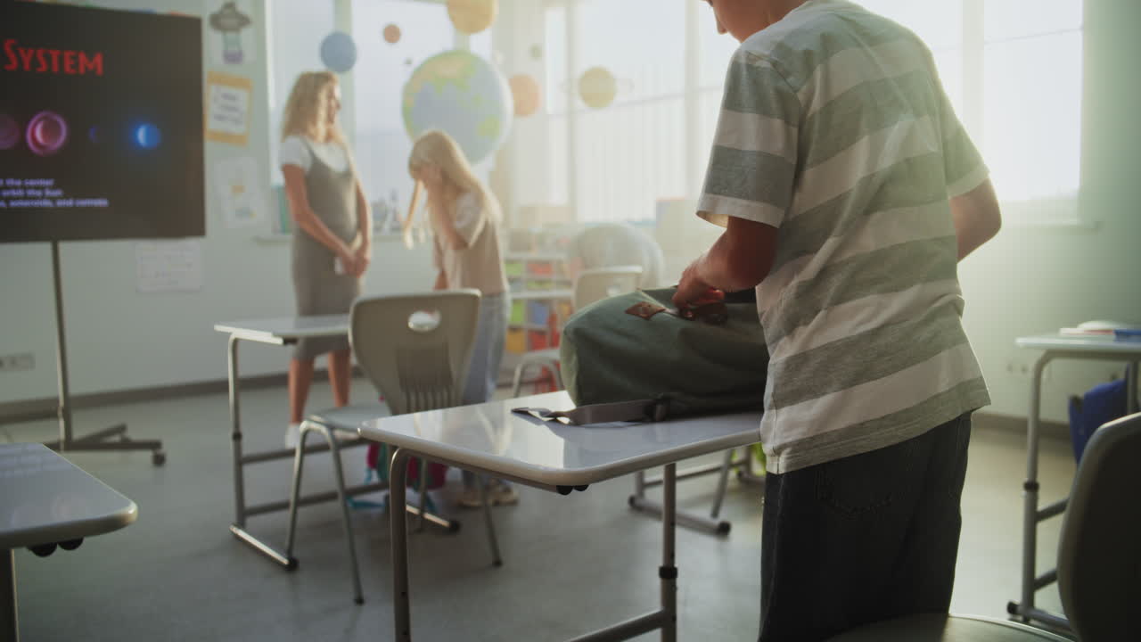 Primary School Children Opening Notebooks Preparing for Writing School Test