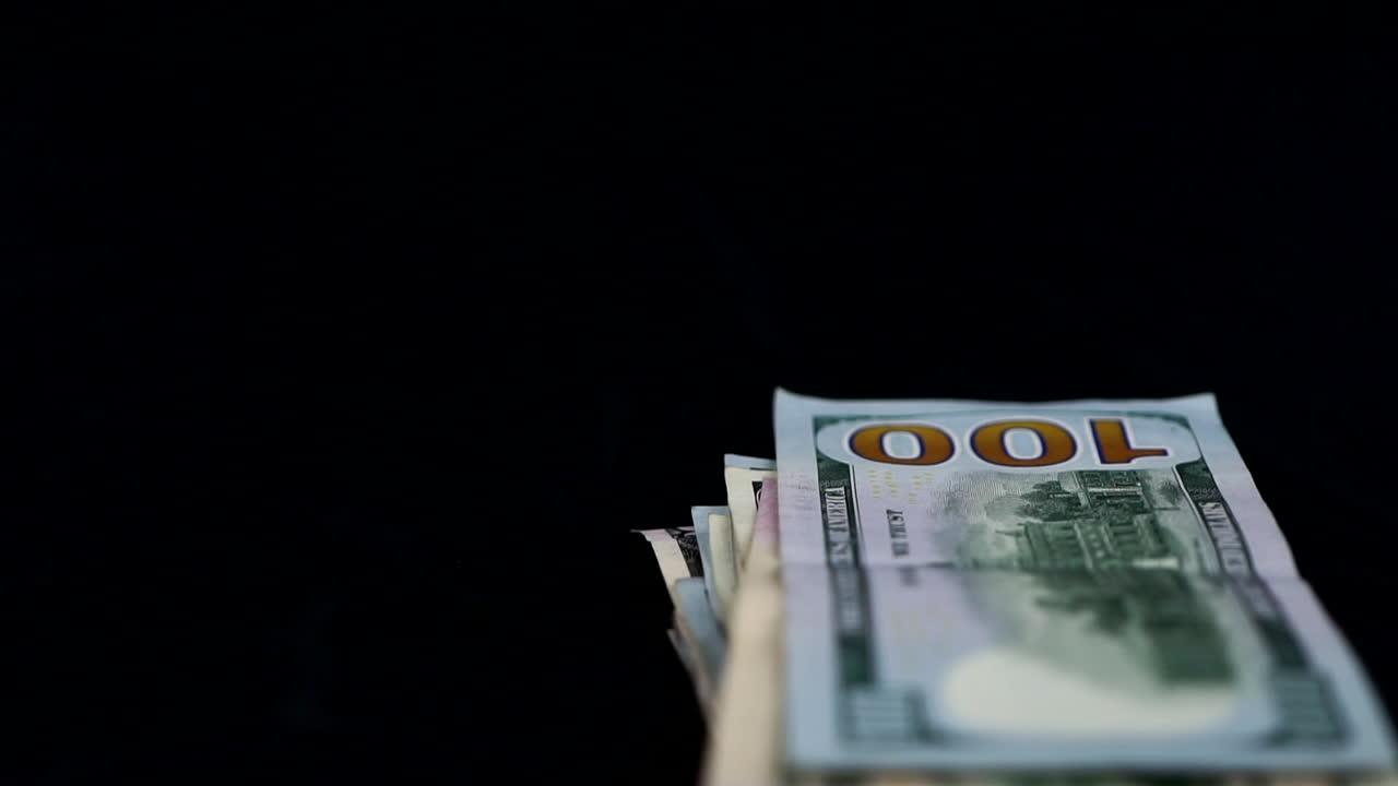 Bundle Of Money In Black Background