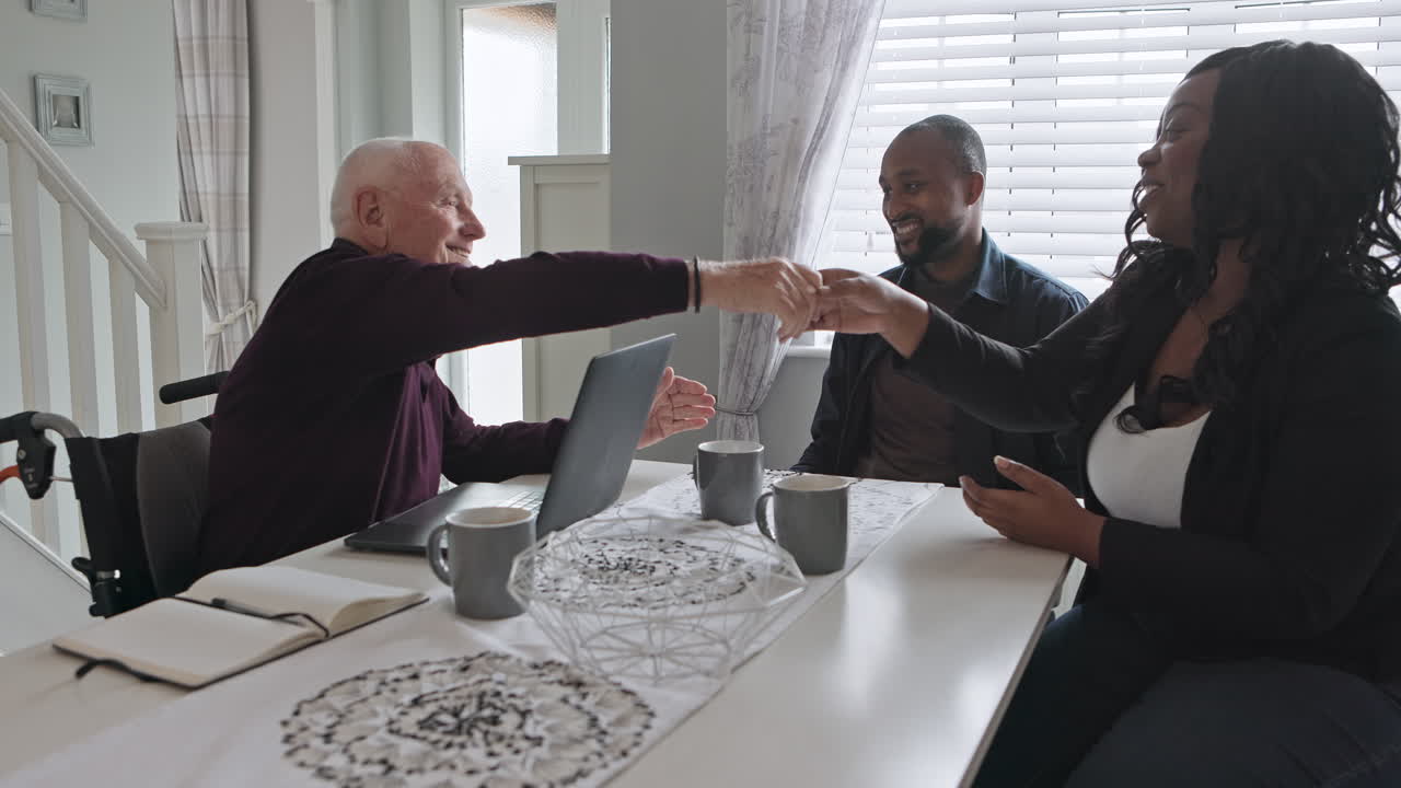 Family members interacting at a table